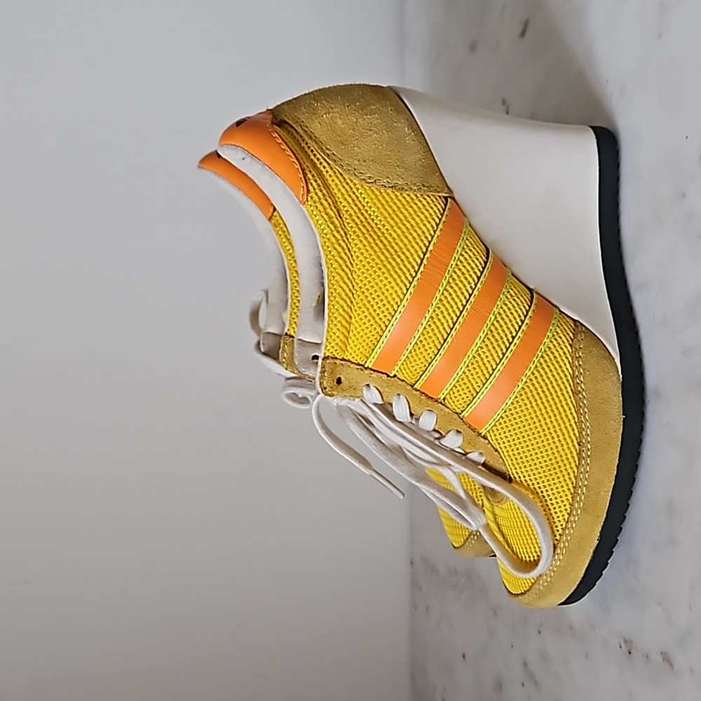 JEREMY SCOTT x ADIDAS: Yellow and orange Arrow wedge sneakers